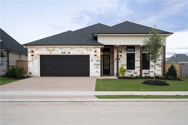 view of front of house featuring a garage and a front yard