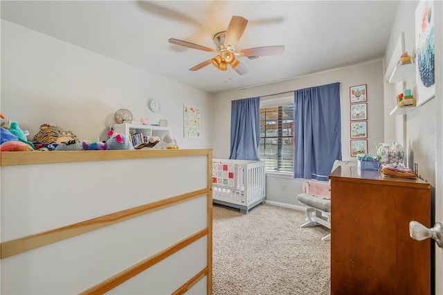 carpeted bedroom featuring ceiling fan and baseboards