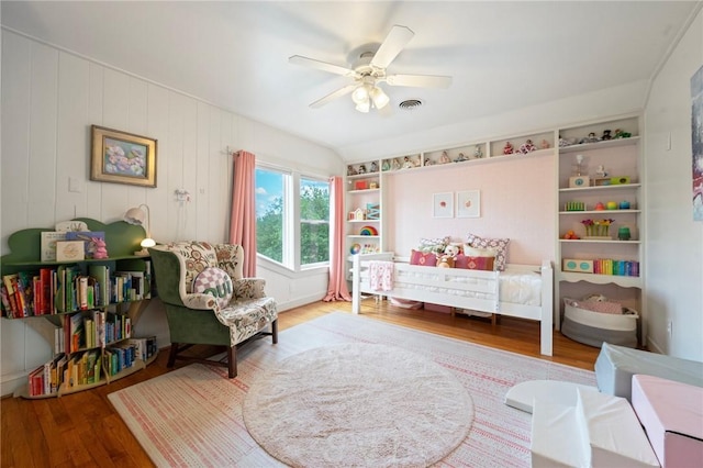 bedroom featuring visible vents, wood finished floors, and a ceiling fan