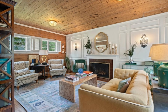 living area featuring a tile fireplace, wood finished floors, and wooden ceiling