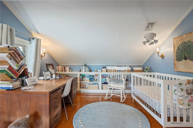 bedroom featuring ornamental molding, visible vents, vaulted ceiling, and wood finished floors