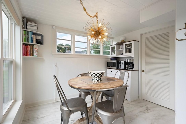 dining area featuring a chandelier