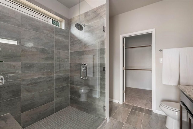 5308 Lyle Pl, Bryan, TX 77807 - bathroom with toilet, a shower stall, vanity, tile patterned flooring, and baseboards