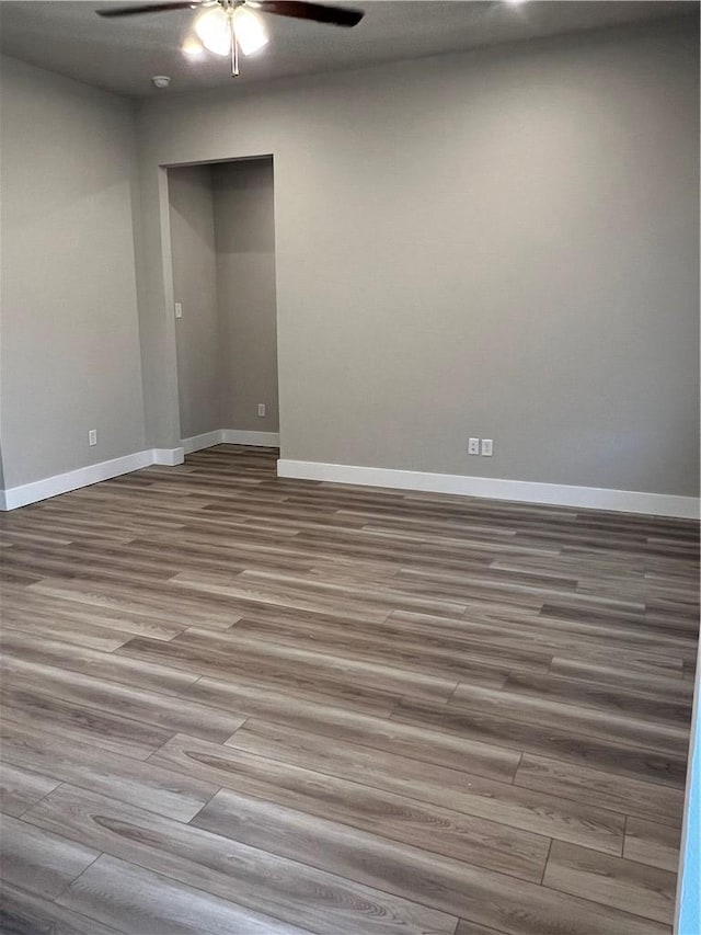 5308 Lyle Pl, Bryan, TX 77807 - empty room featuring wood finished floors, a ceiling fan, and baseboards