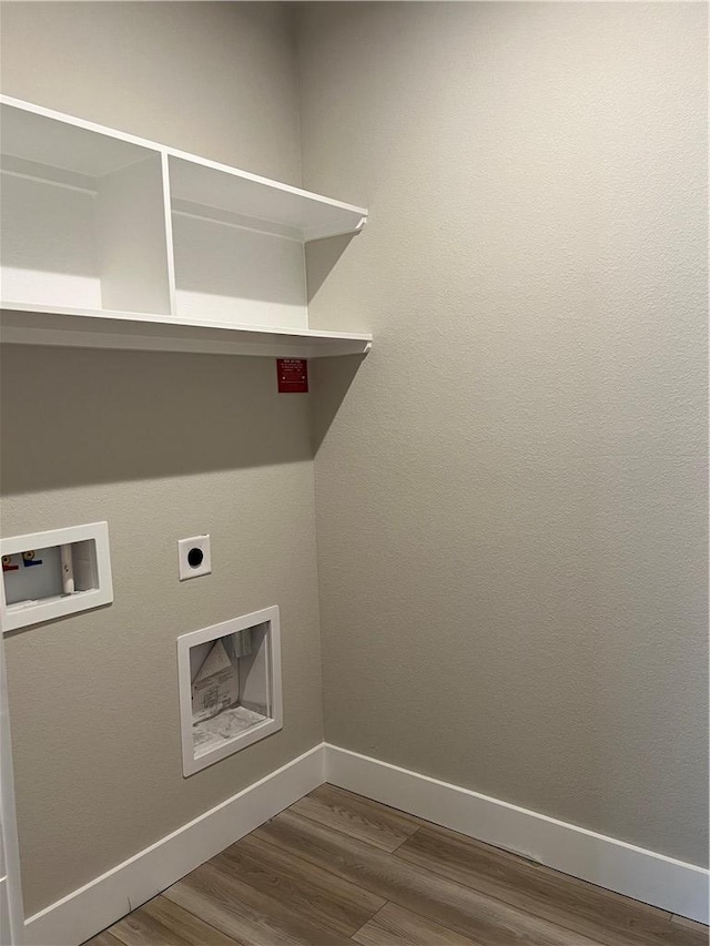 5308 Lyle Pl, Bryan, TX 77807 - washroom with hookup for a washing machine, electric dryer hookup, dark wood finished floors, and baseboards