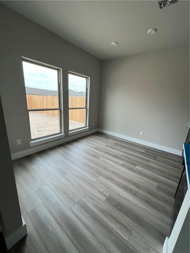 5308 Lyle Pl, Bryan, TX 77807 - empty room with wood finished floors, baseboards, and recessed lighting