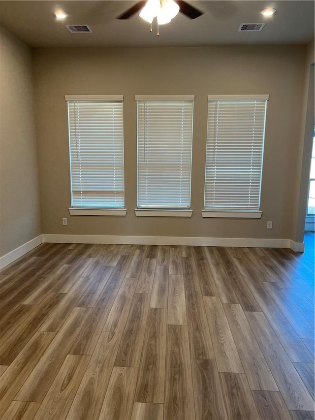 5308 Lyle Pl, Bryan, TX 77807 - empty room with ceiling fan, wood finished floors, baseboards, and recessed lighting