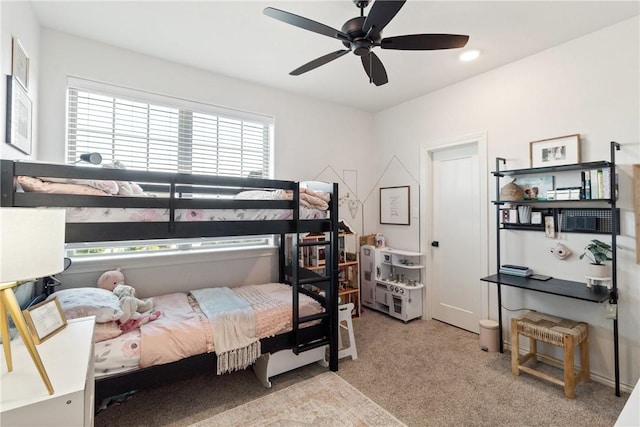 carpeted bedroom featuring ceiling fan