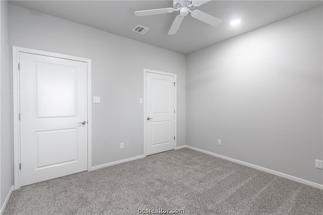 unfurnished room featuring carpet floors and ceiling fan