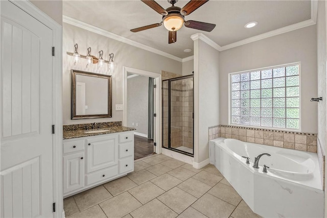 bathroom featuring vanity, tile patterned floors, ornamental molding, and separate shower and tub