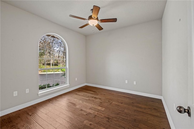 spare room with wood-type flooring and ceiling fan