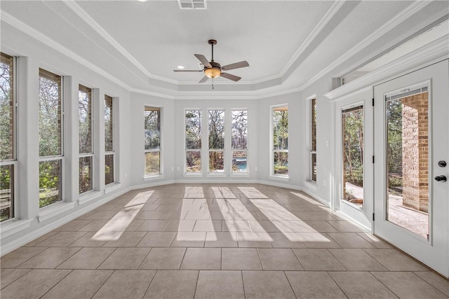 unfurnished sunroom with a tray ceiling and ceiling fan