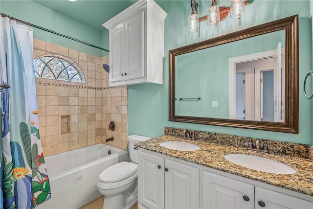 full bathroom with vanity, toilet, and shower / tub combo