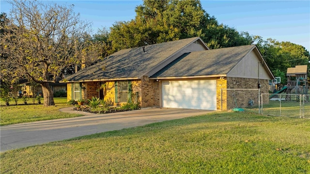 ranch-style home with a front lawn and a garage