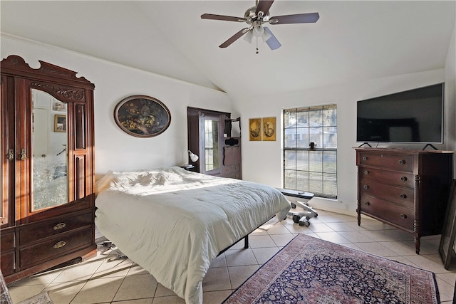 tiled bedroom with vaulted ceiling and ceiling fan