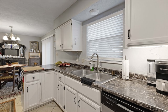 kitchen featuring white cabinetry, sink, stainless steel dishwasher, a notable chandelier, and kitchen peninsula