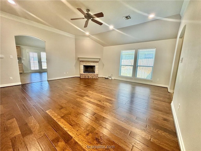 unfurnished living room featuring dark hardwood / wood-style floors, ceiling fan, plenty of natural light, and a fireplace