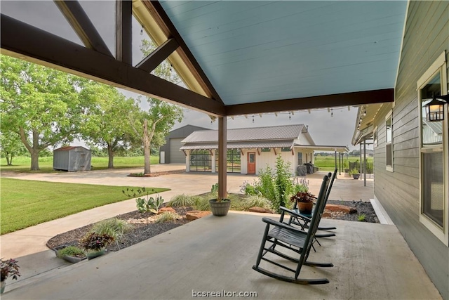 view of patio featuring a storage unit