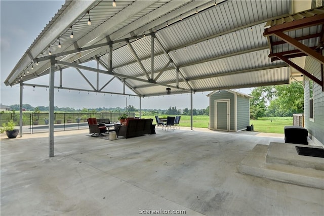 view of patio / terrace featuring a gazebo and a shed