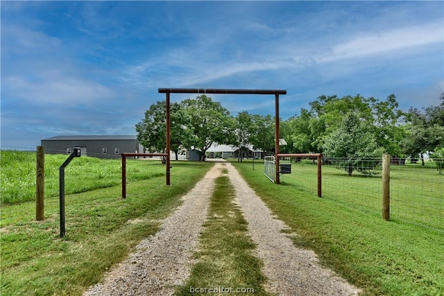 view of home's community featuring a lawn