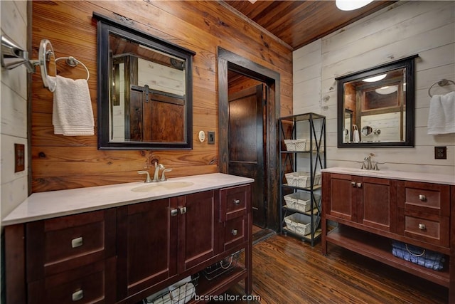 bathroom featuring wood walls, vanity, wood ceiling, and hardwood / wood-style flooring