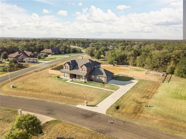 aerial view featuring a rural view and a view of trees