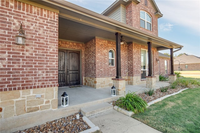 doorway to property with brick siding