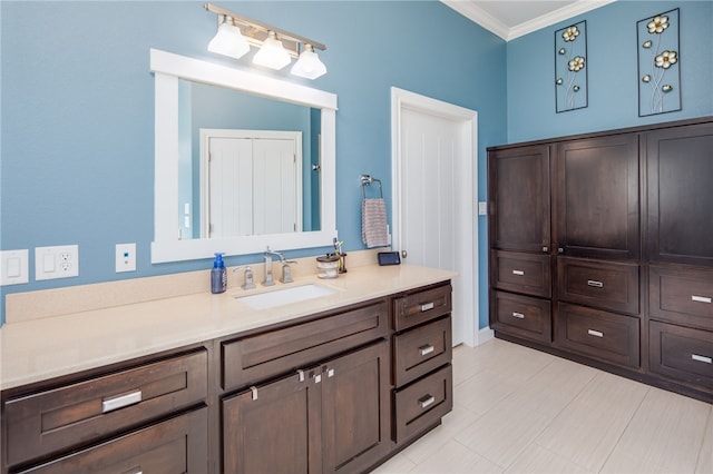 bathroom with crown molding and vanity