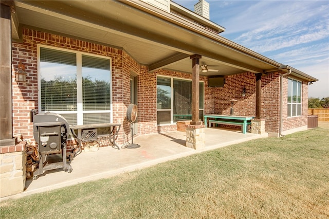 view of patio with ceiling fan and grilling area