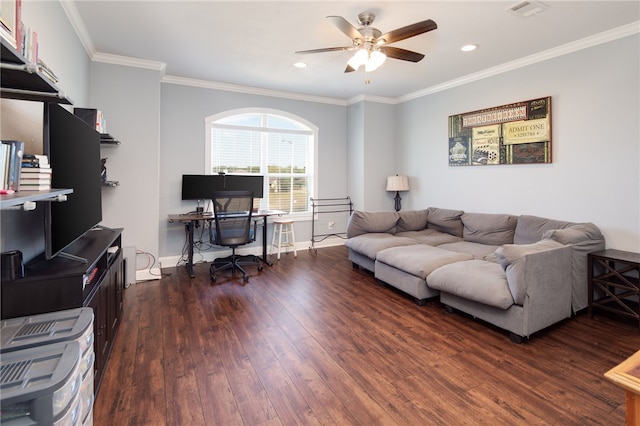 living room featuring wood finished floors, baseboards, visible vents, ceiling fan, and crown molding