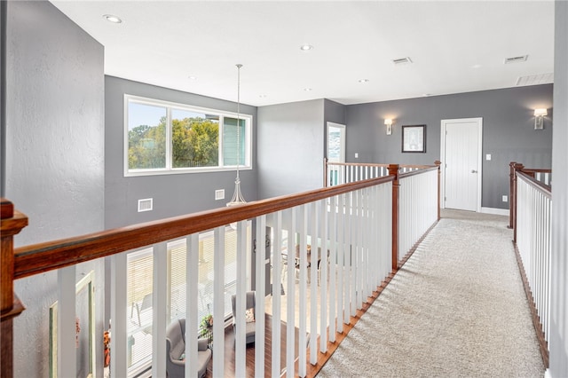 corridor with recessed lighting, carpet, and visible vents