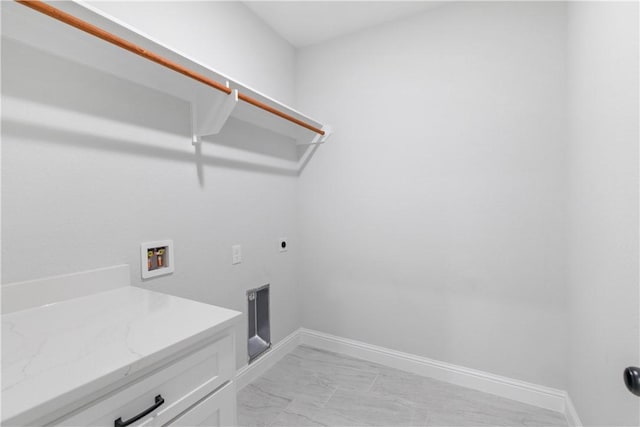 clothes washing area featuring washer hookup, marble finish floor, cabinet space, hookup for an electric dryer, and baseboards