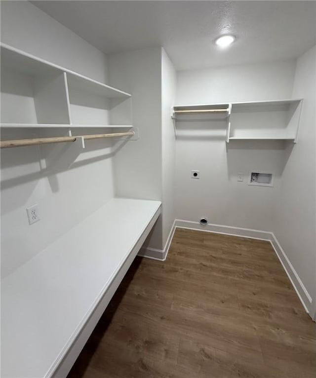 clothes washing area with washer hookup, hookup for an electric dryer, and dark hardwood / wood-style flooring