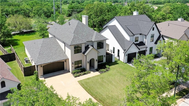 birds eye view of property with a wooded view