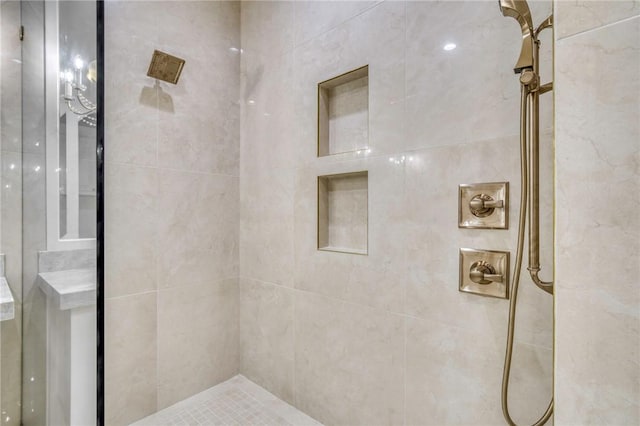 full bath featuring a tile shower