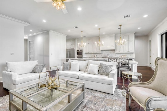 living area with crown molding, dark wood-style floors, and recessed lighting