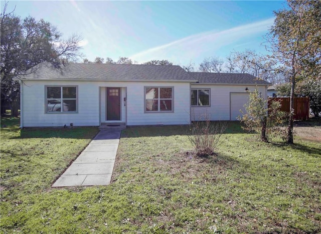 single story home with a garage and a front yard