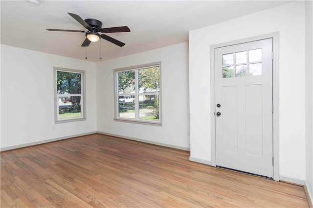 foyer entrance featuring ceiling fan and light hardwood / wood-style floors