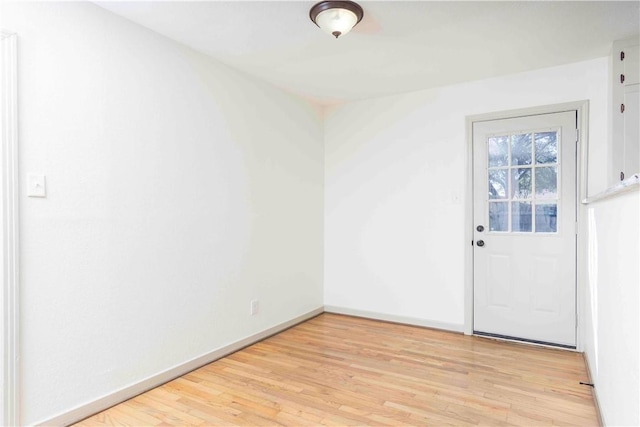 unfurnished room with light hardwood / wood-style flooring