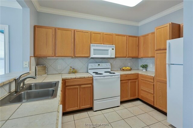 801 Luther St W Unit 407, College Station, TX 77840 - kitchen featuring white appliances, tasteful backsplash, crown molding, light tile patterned floors, and tile countertops