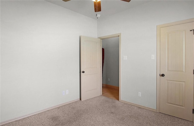 10175 Steep Hollow Rd, Bryan, TX 77808 - carpeted spare room featuring a ceiling fan and baseboards
