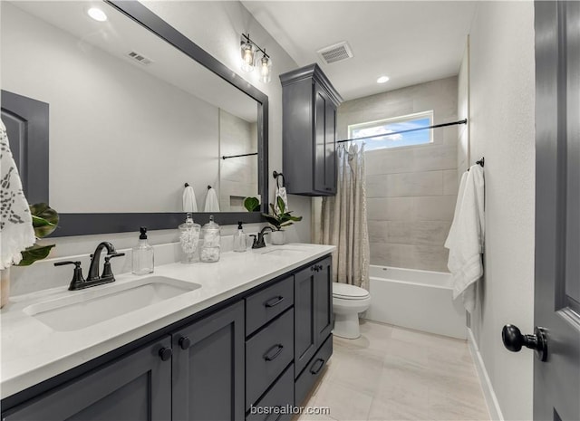 full bathroom with vanity, toilet, and shower / tub combo with curtain