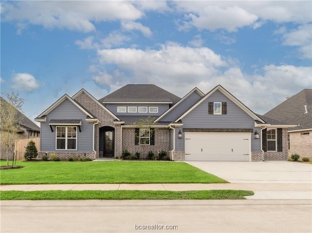 craftsman house with a garage and a front yard