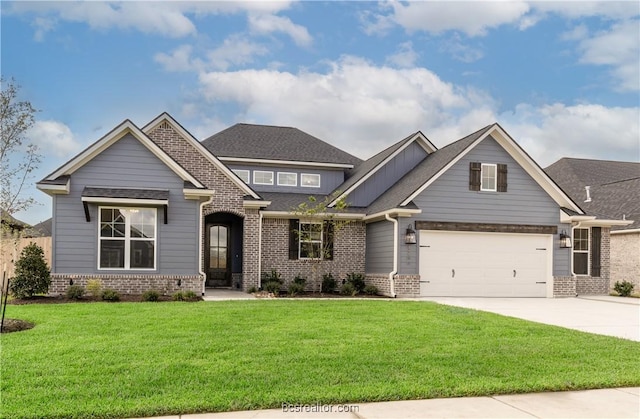 craftsman-style home featuring a garage and a front lawn