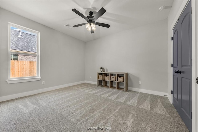 spare room with carpet floors and ceiling fan