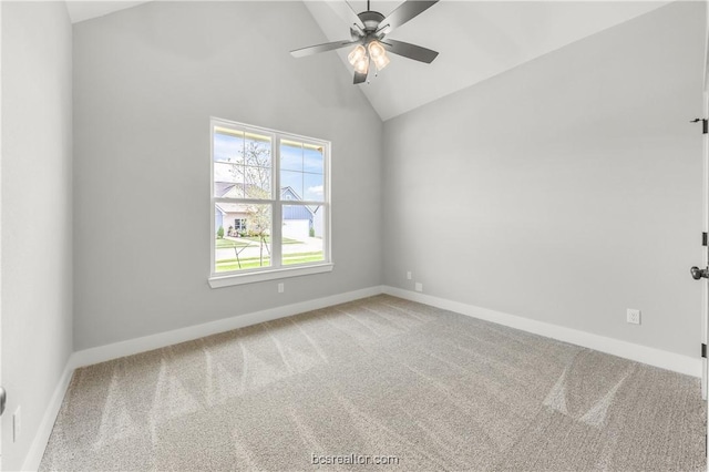 carpeted empty room with ceiling fan and lofted ceiling