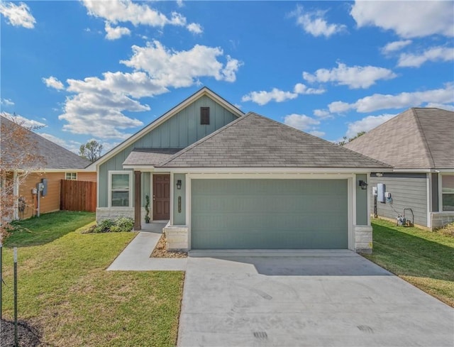 view of front facade with a front yard and a garage