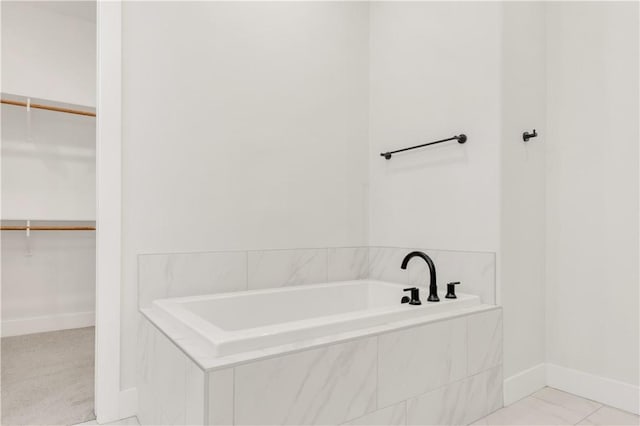 1701 Kerr Valley Ln, College Station, TX 77845 - full bathroom featuring a bath and a walk in closet