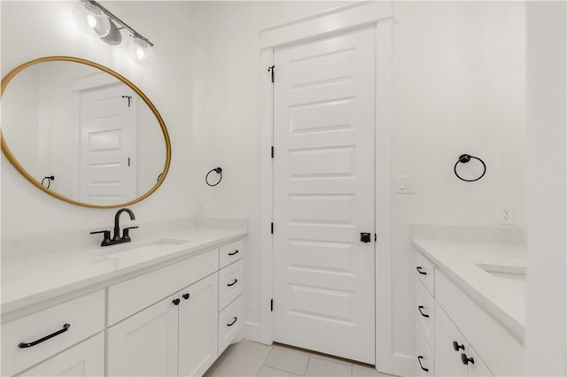 1701 Kerr Valley Ln, College Station, TX 77845 - bathroom featuring two vanities and tile patterned floors