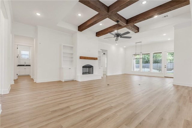 1701 Kerr Valley Ln, College Station, TX 77845 - unfurnished living room with recessed lighting, light wood-style flooring, ceiling fan, beam ceiling, and coffered ceiling